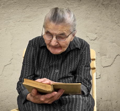 Elderly woman prays