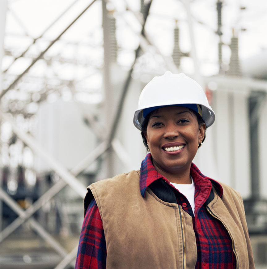 Happy woman working in power plant