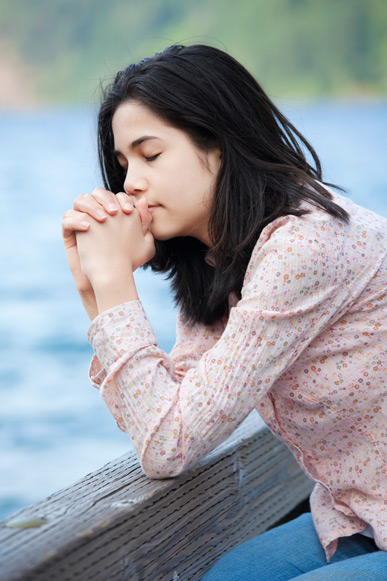 Teenage girl praying