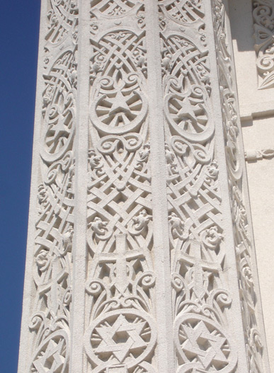 Pillar with religious symbols