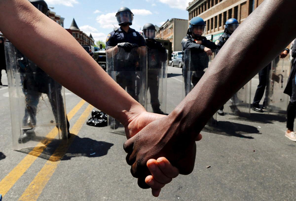 protesters-hold-hands-baltimore