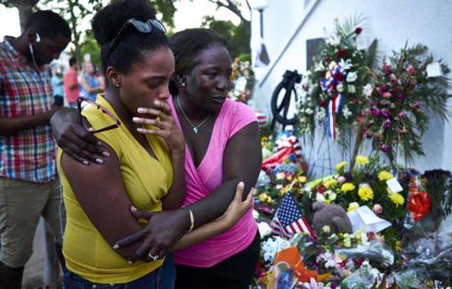 People mourning at AME Church in Charleston
