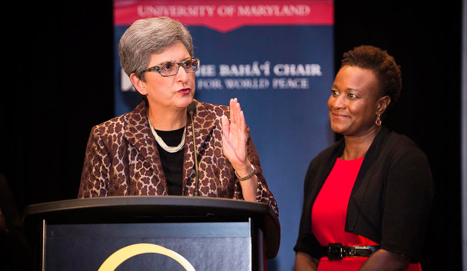 Dr. Hoda Mahmoudi (left), holder of the Baha’i Chair for World Peace, addresses the audience of the Global Transformations conference at the University of Maryland. Dr. Prudence Carter, a sociologist at Stanford University, is on the right.