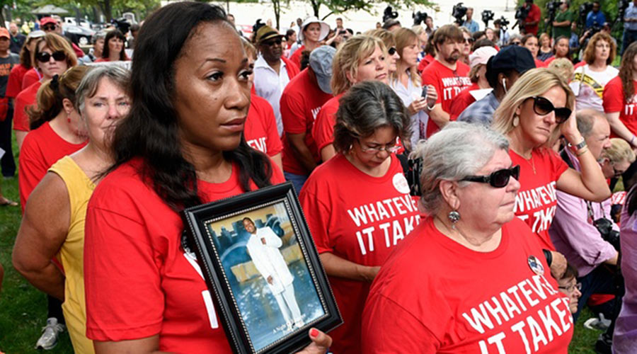 Pam Bosley of Chicago, left, holds a photo of her son Terrell Bosley, who was killed in 2006 when he was 18, as she attends a rally against gun violence in September on Capitol Hill. Photograph: Susan Walsh/AP
