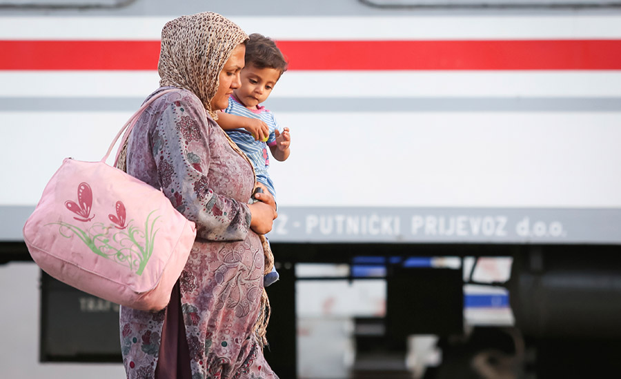 Croatia 2015 (A Syrian woman with a child walking on the railway after arriving from Serbia)
