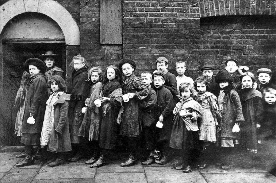 Children in line for breakfast in London circa 1900.
