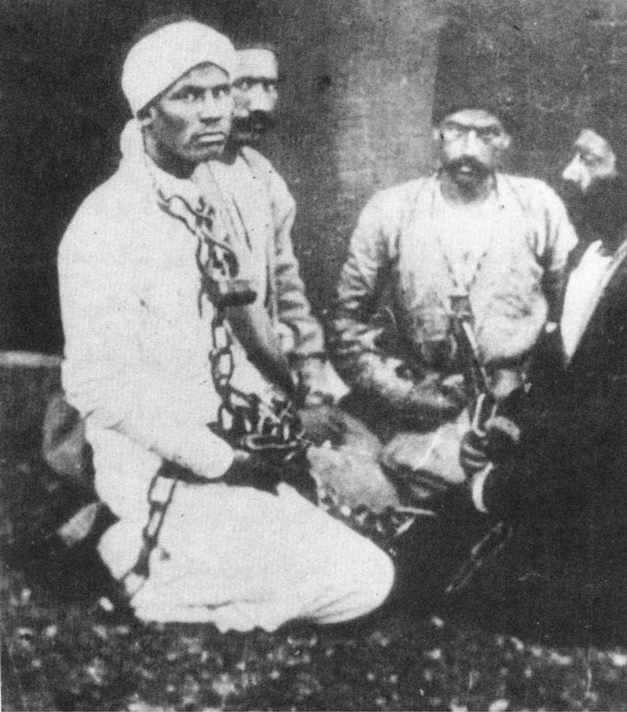 Photograph of Badi in chains