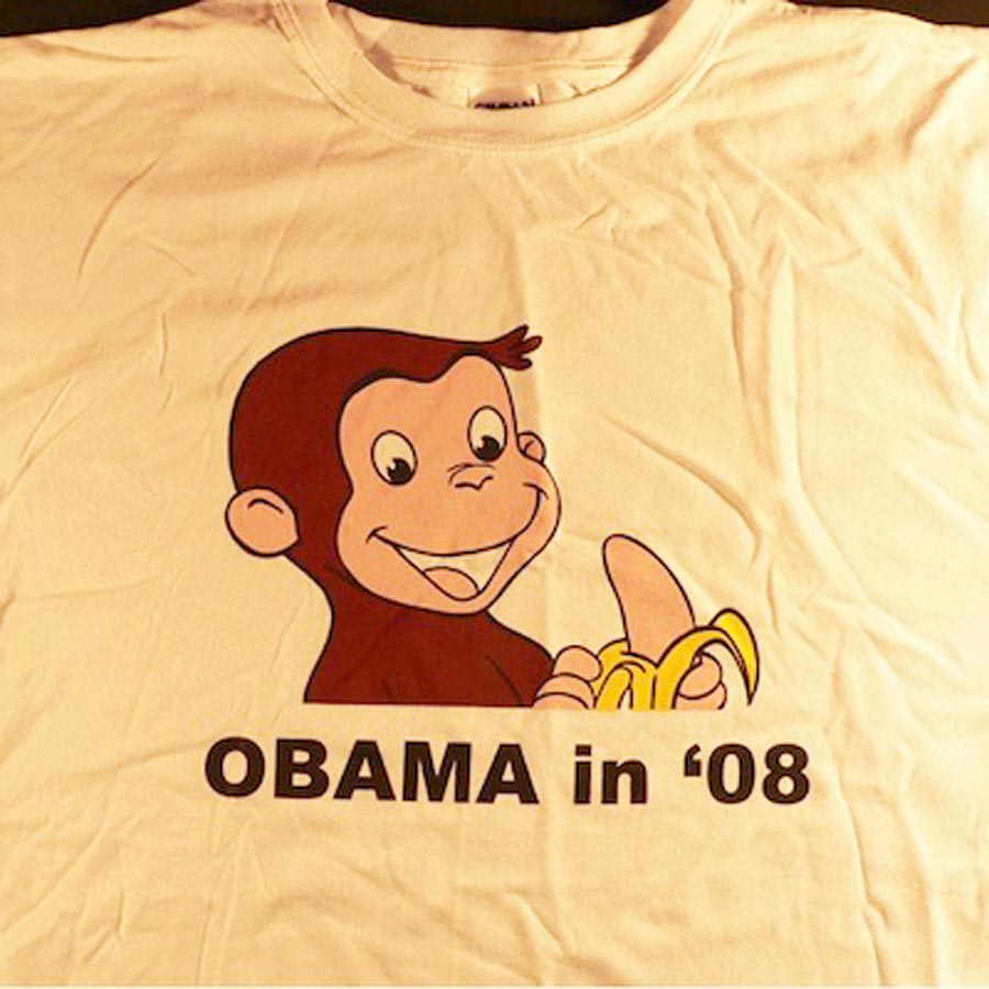 Racist depiction of Obama as Curious George on a t-shirt. 