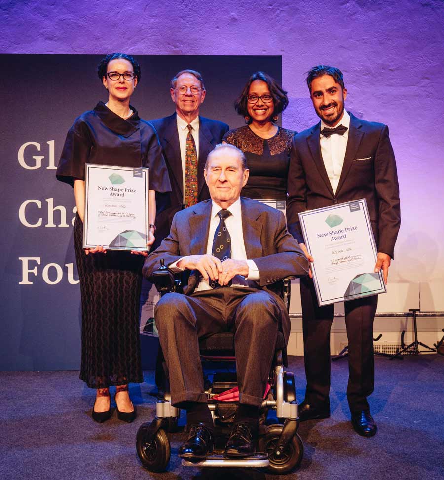 Maja Groff (left), Arthur Dahl, and two other winners of the New Shape Prize award stand with Laszlo Szombatfalvy (front), the founder and chairman of the Global Challenges Foundation. (Photo by Global Challenges Foundation)
