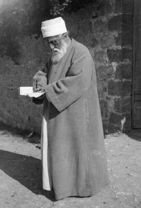 Abdu’l-Baha pens a letter while He was in the Holy Land in 1920.