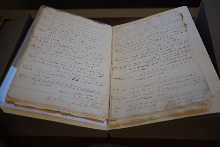 One of the archives pieces on display at the event: a sacramental register kept by the Jesuits at St. Francis Xavier Church in the state of Maryland. It records baptisms of free and enslaved people in the 1820s and 1830s.