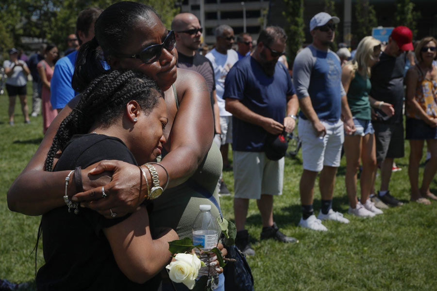 Mourners gather for vigil in Dayton, Ohio. (AP Photo/John Minchillo)