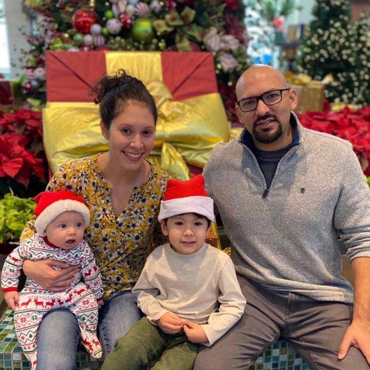 Elaina Barroso and Aaron Ginoza with their children.