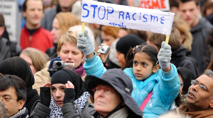Multiethnic crowd participating in an anti-racism protest.