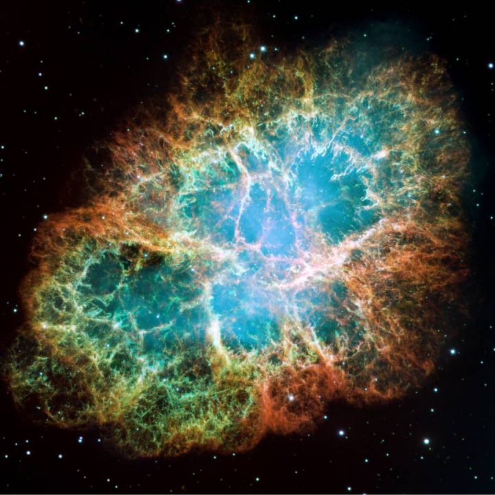 A mosaic image, one of the largest ever taken by NASA's Hubble Space Telescope, of the Crab Nebula, a six-light-year-wide expanding remnant of a star's supernova explosion.