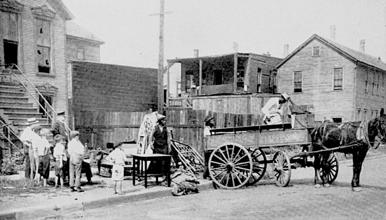 Black family leaving damaged home after the Chicago race riot of 1919