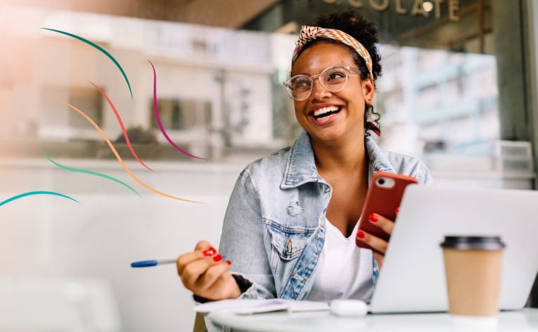 A black woman smiling while working: the baha'i concept of true wealth