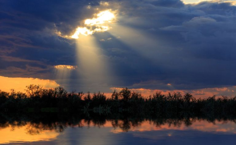 Sunlight breaking through the clouds above the Tigris river.