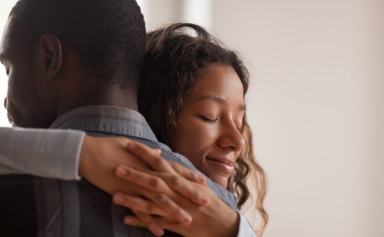 two people hugging and displaying emotional safety